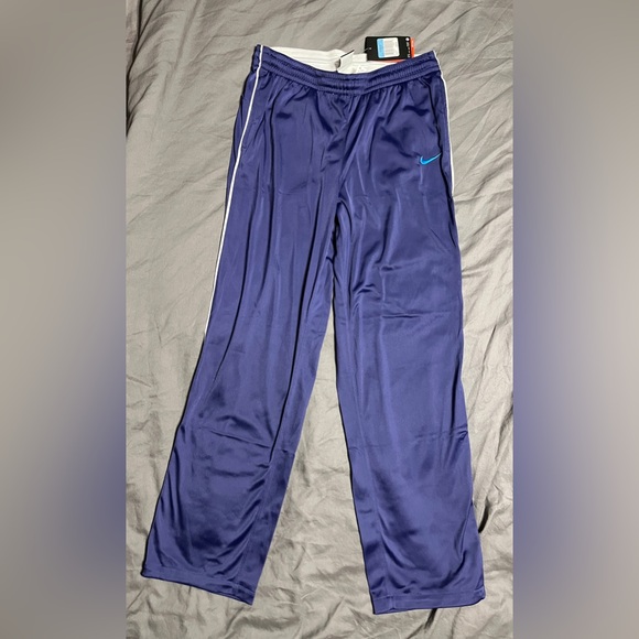 Nike Purple Athletic Pants with White Accents and Blue Swoosh - Picture 1 of 3